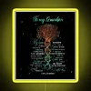 Neon sign with tree design, DNA helix, and yellow background.