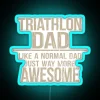A triathlete dad displaying a neon sign with an enthusiastic expression, conveying the excitement of being both a parent a...