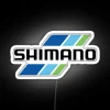 Neon-lit sign displaying triple Shimanos fishing tackle in vibrant RGB colors.