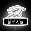 Triumph Stag logo with neon signage on white background.