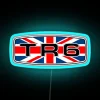 Triumph TR6 badge with Union Jack flag, neon sign in RGB colors.