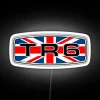 Neon sign with Triumph TR6 badge featuring the Union flag in RGB colors.
