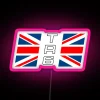 Triumph TR6 rear wing decal with Union Jack neon sign on a pink background