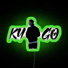 Tropical house with neon green sign in a vibrant cityscape at night