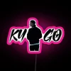 Tropical house neon sign with pink glow at night.