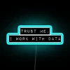 Neon sign with bold, blue font reading 'Trust me, I work with data'