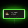 Neon green sign with bold, white letters displaying the phrase 'Try Fingers But Hole'