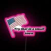 Neon sign reading 'Try That in a Small Town'