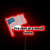 A neon sign in a small town with bold, colorful letters that read "Try That". Alt text: "Neon sign in a small town with th...
