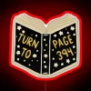 Neon sign with glowing red 'Turn to Page' lettering on a dark background.