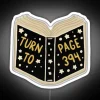 Neon sign with glowing neon letters on a white background, reading "Turn to Page