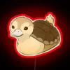 Turtle-documented at night with neon sign
