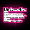 Insurance professional defines underwriting with humor in neon-lit background.