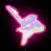 Neon pink RGB signage in a futuristic cityscape.