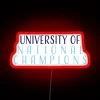 Neon university sign in red with university of national champions logo illuminated.