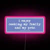 Neon sign with vibrant pink letters reading 'Use Commas'
