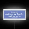 Neon sign with colorful, glowing letters spelling out 'use commas'