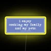 Neon sign with colorful RGB lights spelling out 'Use Commas'