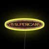 Neon-lit V8 Supercars championship sign with vibrant colors.