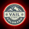 Neon Vail Colorado sign in red color at night.