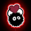 Neon sign with a Valentine's Day theme, featuring a red-colored sprite in a soot-covered glass-like appearance.