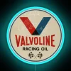 Neon racing sign with Valvoline logo, vibrant blue color.