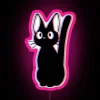 Neon-lit vaporwave cat standing in front of a colorful, distorted cityscape at sunset.
