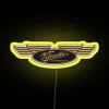Velocette motorcycle logo with neon RGB design on a yellow background.