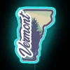 Vibrant neon sign in the colors of Vermont's state flag, featuring red, green, and blue hues.
