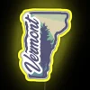 Neon sign reading 'Vermont' in yellow with RGB lighting effects
