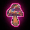 Neon pink mushroom signage with colorful, glowing accents.