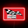 Vintage champion LED sign with red neon lighting on a spark plug design