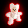 Vintage kawaii-inspired rubber teddy bear with neon RGB sign