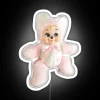 Vintage kawaii teddy bear with neon RGB sign on its chest, surrounded by a distressed white background.