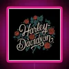 Vintage motorcycle logo with neon pink accents on a retro style sign