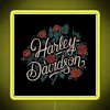 Vintage neon motorcycle logo on a retro sign with yellow glow.
