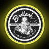 Neon sign outside vintage Birdland Jazz Club with vibrant RGB lights at night.