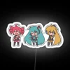 Three Vocaloid chibi characters under an RGB neon sign reading 'Baka'