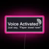 RGB neon sign with pink color scheme on a voice-activated LED dispenser for paper towels.