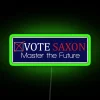 Neon sign with colorful, glowing letters reading 'Vote Harold Saxon'