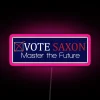 Neon sign with RGB colors promoting Harold Saxon as a vote option.