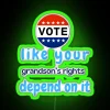 Neon sign with bold, rainbow-colored letters reading 'Vote Like Your Grandson's Rights Depend on It'