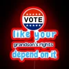 Neon sign emphasizing voting importance with a generational twist, highlighting the responsibility to protect future gener...