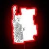 Freedom's neon glow: Liberty statue lit up in vibrant colors, symbolizing democracy's importance.
