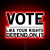 Vibrant RGB neon sign reading 'Vote Like Your Rights Depend On It'