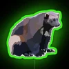 Wolverine logo in neon green on a street sign
