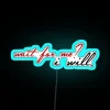 Neon sign with glowing blue letters reading 'Wait For Me'