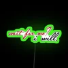 Neon sign with the phrase 'Wait For Me' in bold, green letters.