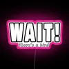 Bright pink neon sign with the words 'Wait, there's a bird!' written in bold letters.