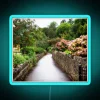Walkway with a neon sign reading 'Cheddar' in England